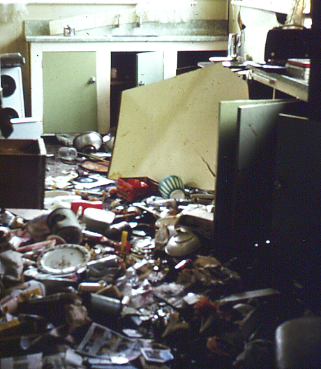 the room is full of broken up appliances and dirty dishes