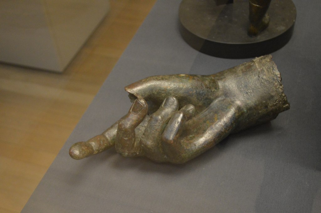 a sculpture of two hands touching each other