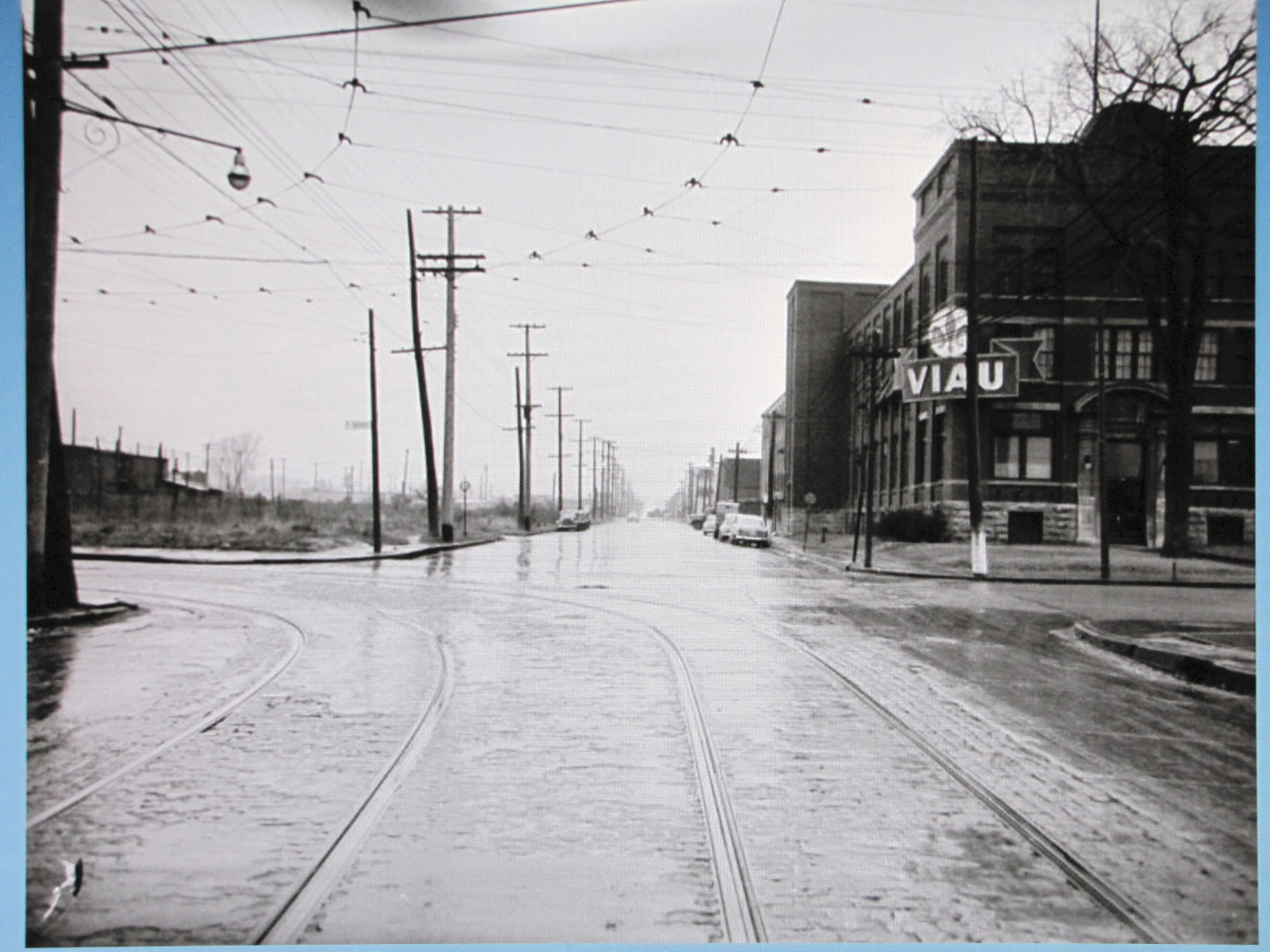 a city street with a bus on the tracks