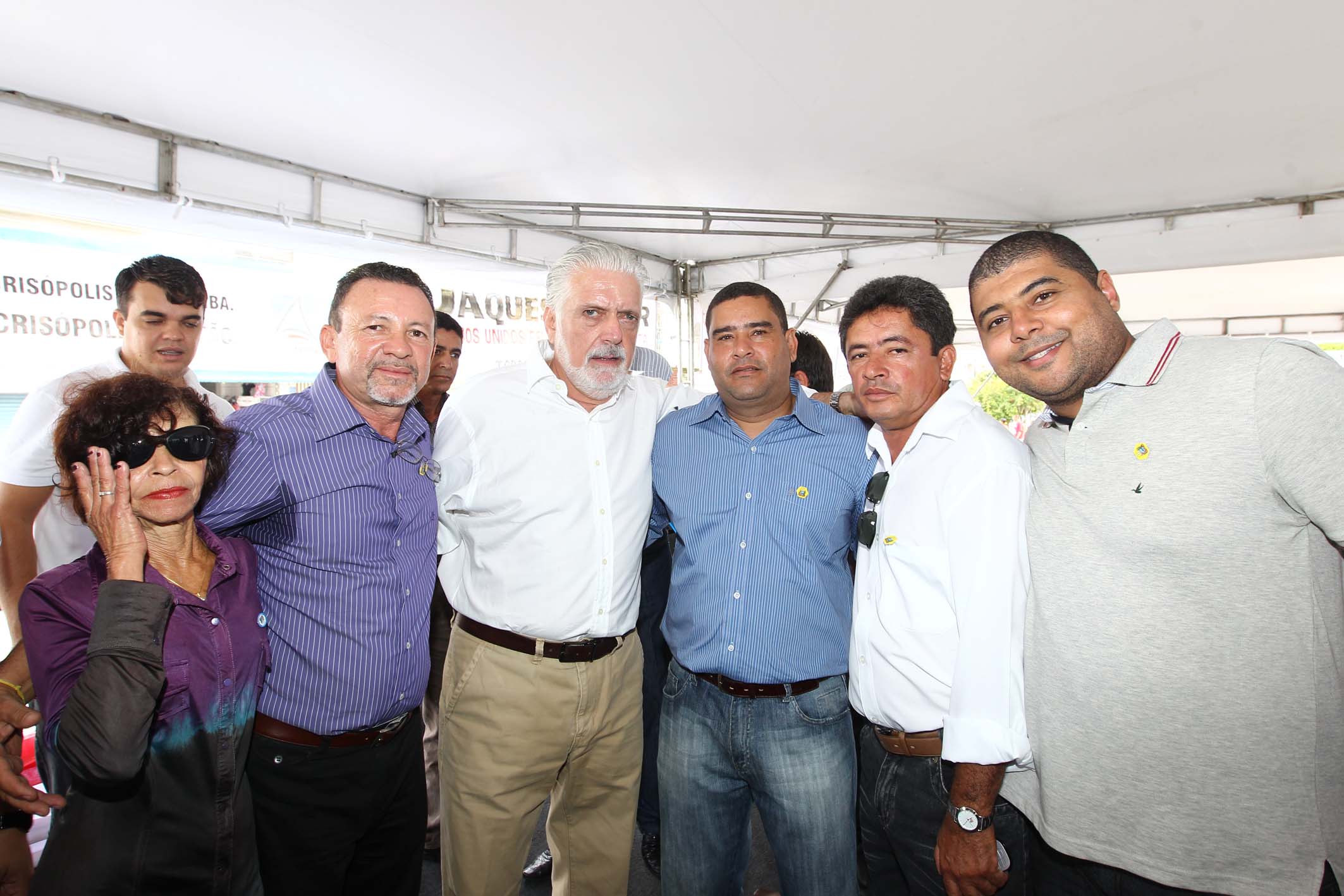 a group of men wearing eye glasses pose together