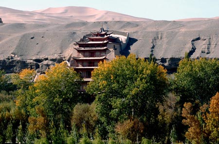 a landscape view of a building in the background with mountains
