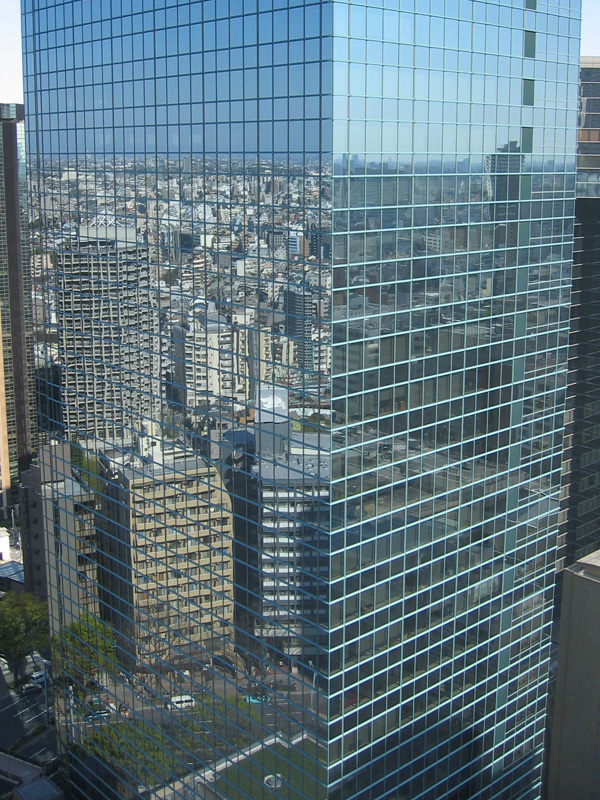 a large building with multiple windows in a city