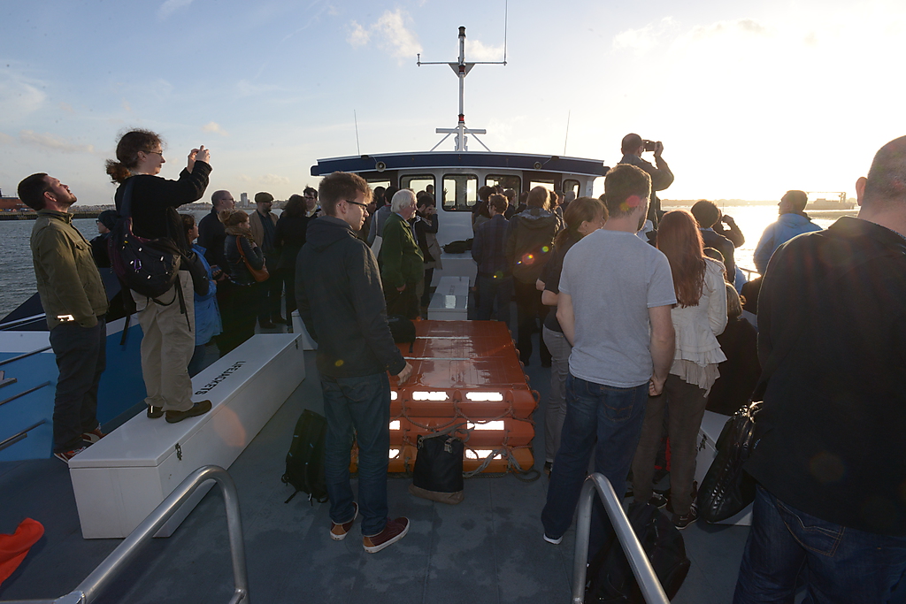 a group of people on the boat with luggage