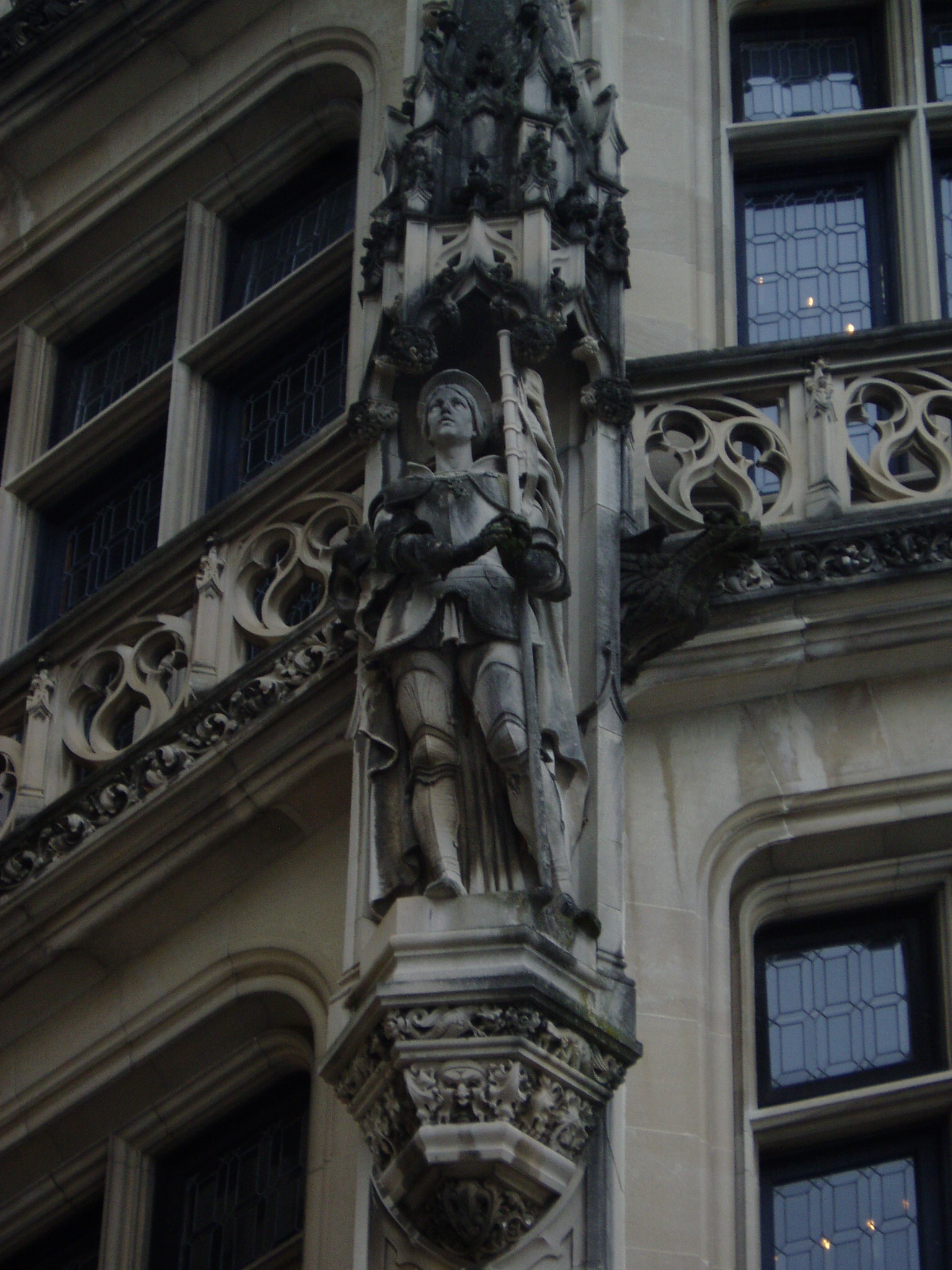 a statue on a building next to an entrance way