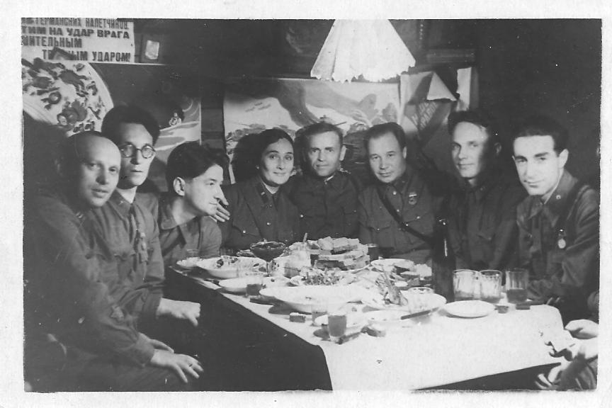 a group of men sitting around a table