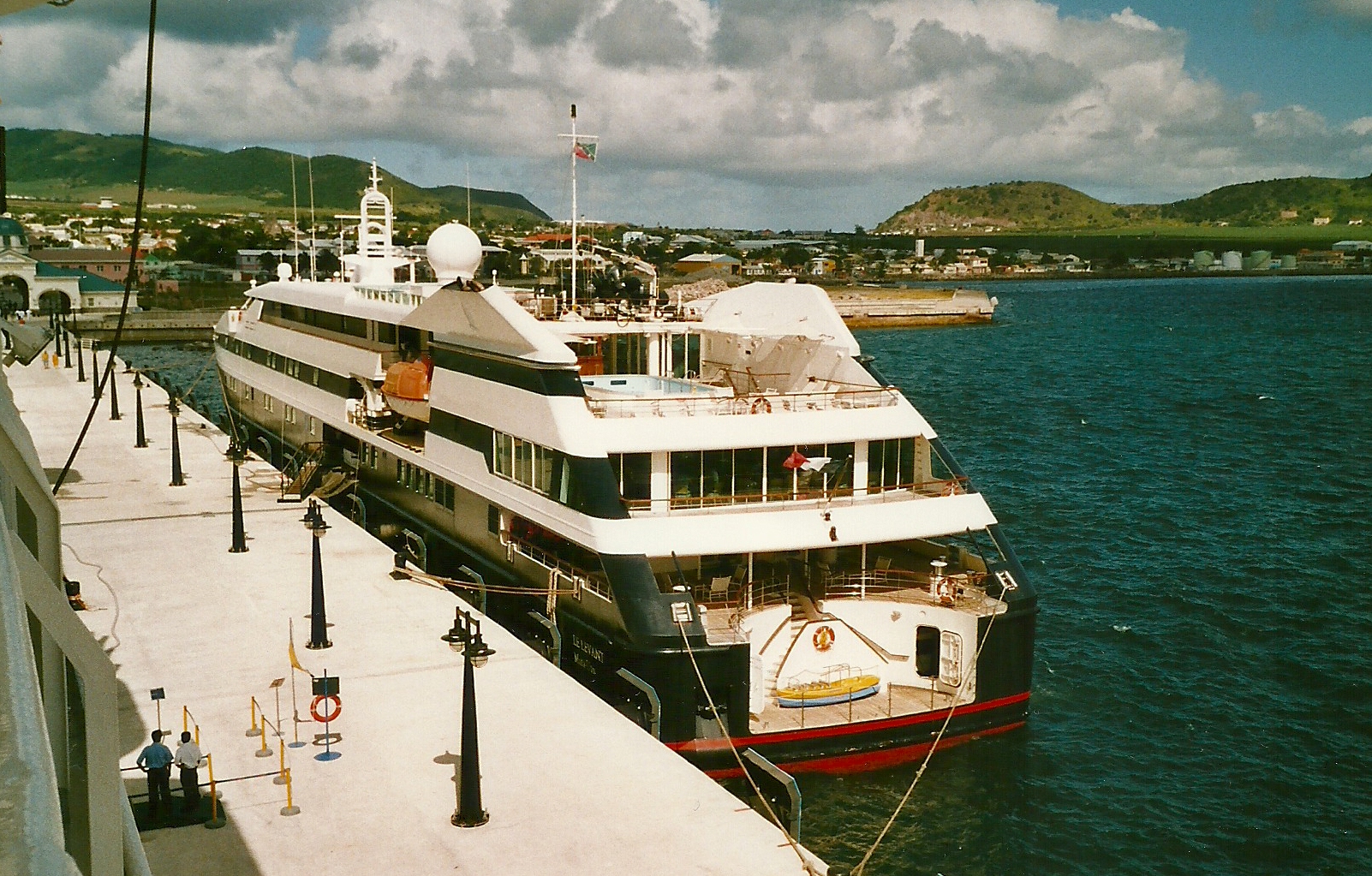 a large white and red boat in the water