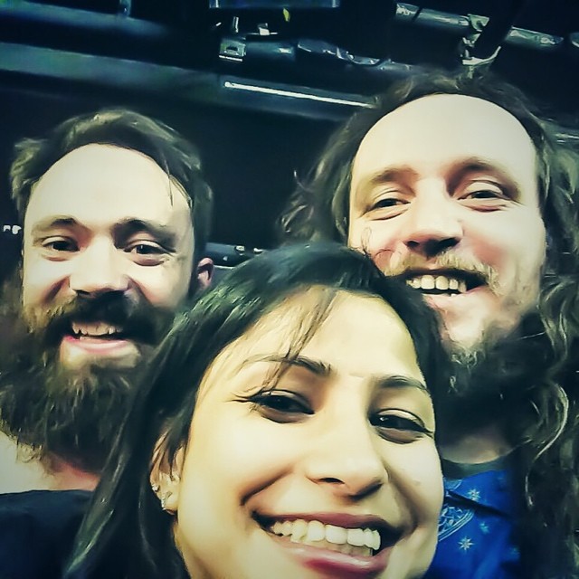 three people smiling with long hair and beards