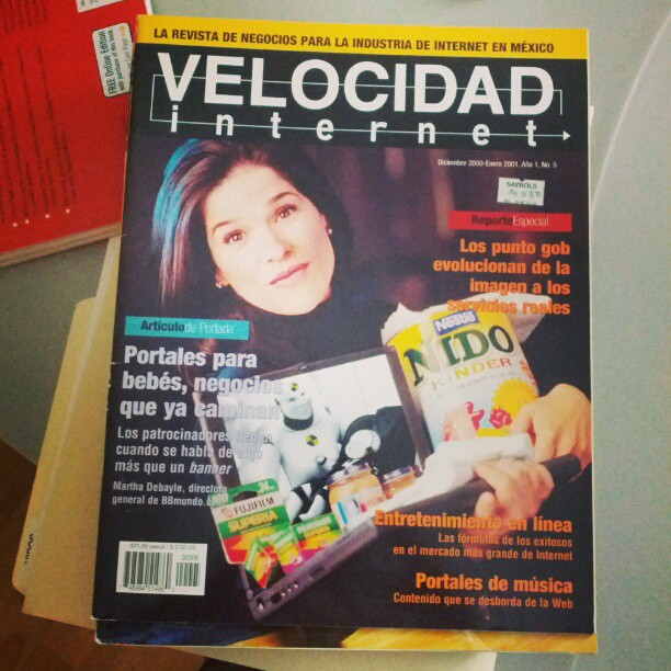 a magazine featuring a young woman holding a magazine
