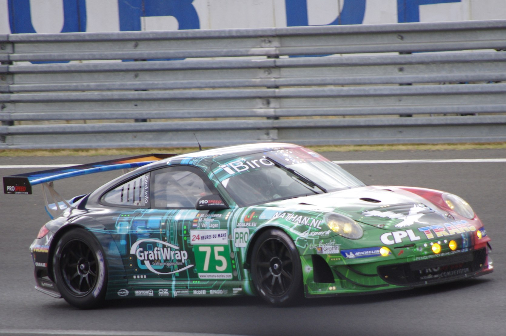 a race car driving around a corner on the racetrack