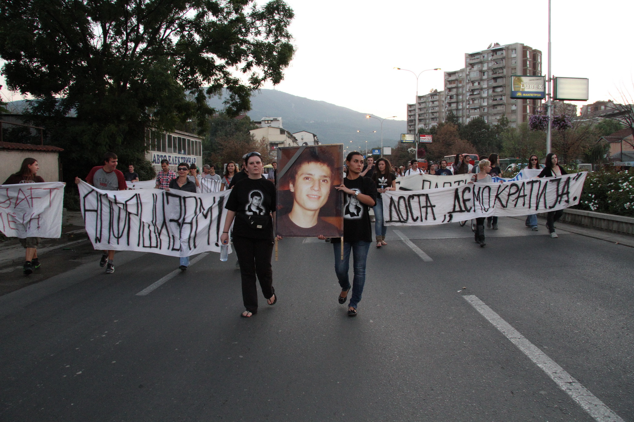 there are many people marching down the street