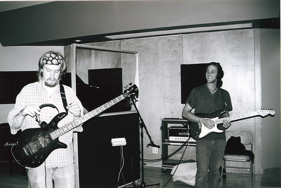 a black and white po shows two men playing guitar