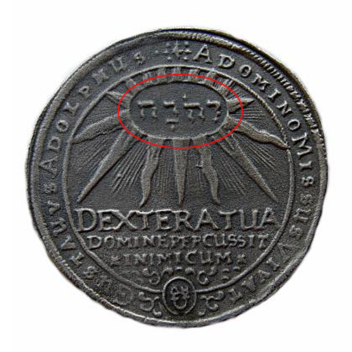 an old medal with a red circle on top