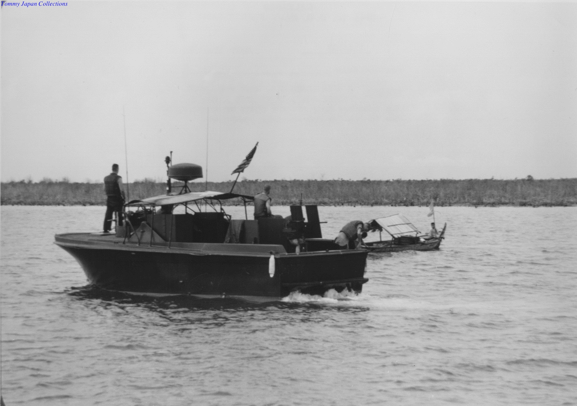 black and white pograph of two small boats on the water