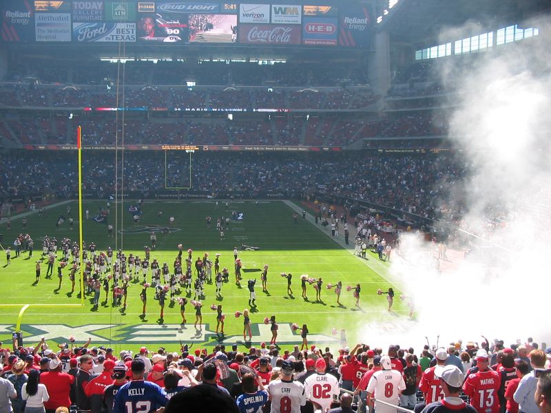 a football team is on the field in a stadium