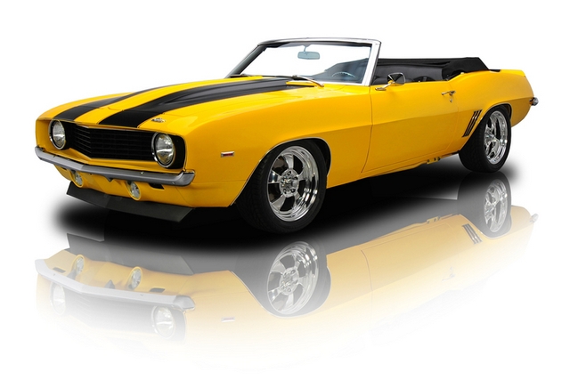 a yellow and black car on a white background