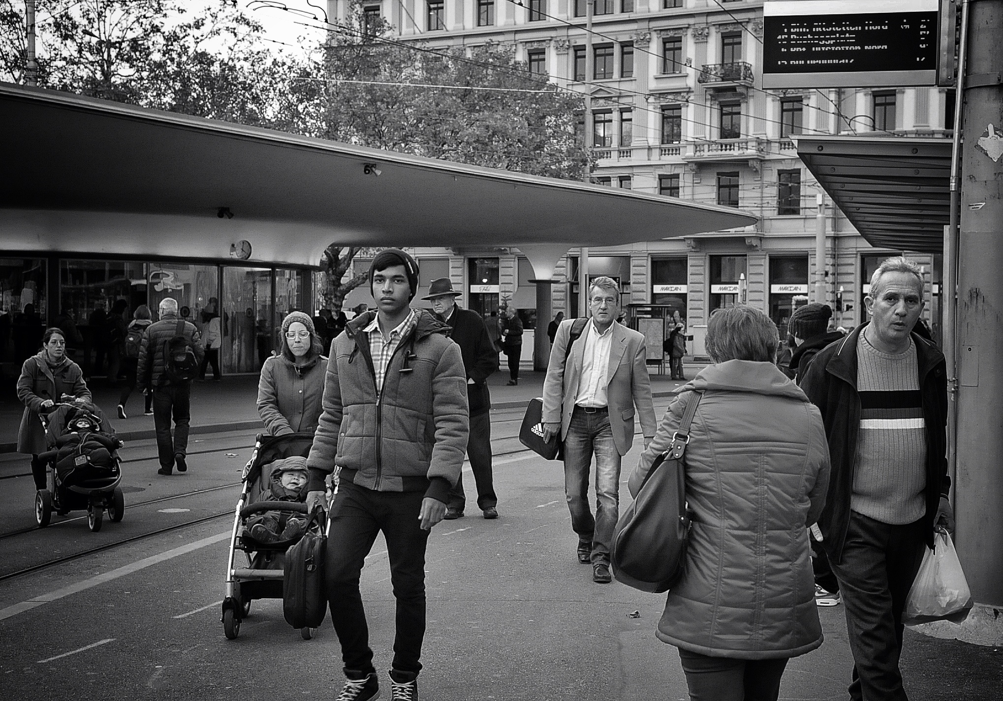 the people are walking together in the city