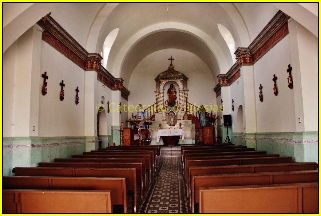 inside of a church with chairs and alters