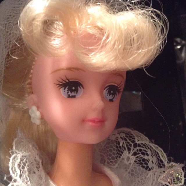an image of a doll wearing wedding dress