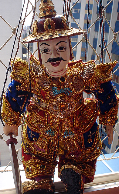 a carnival clown is on display as a man