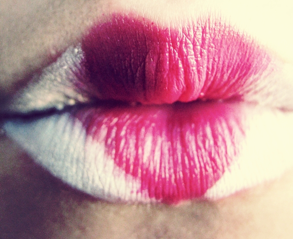 a close up s of a womans lipstick on the lips
