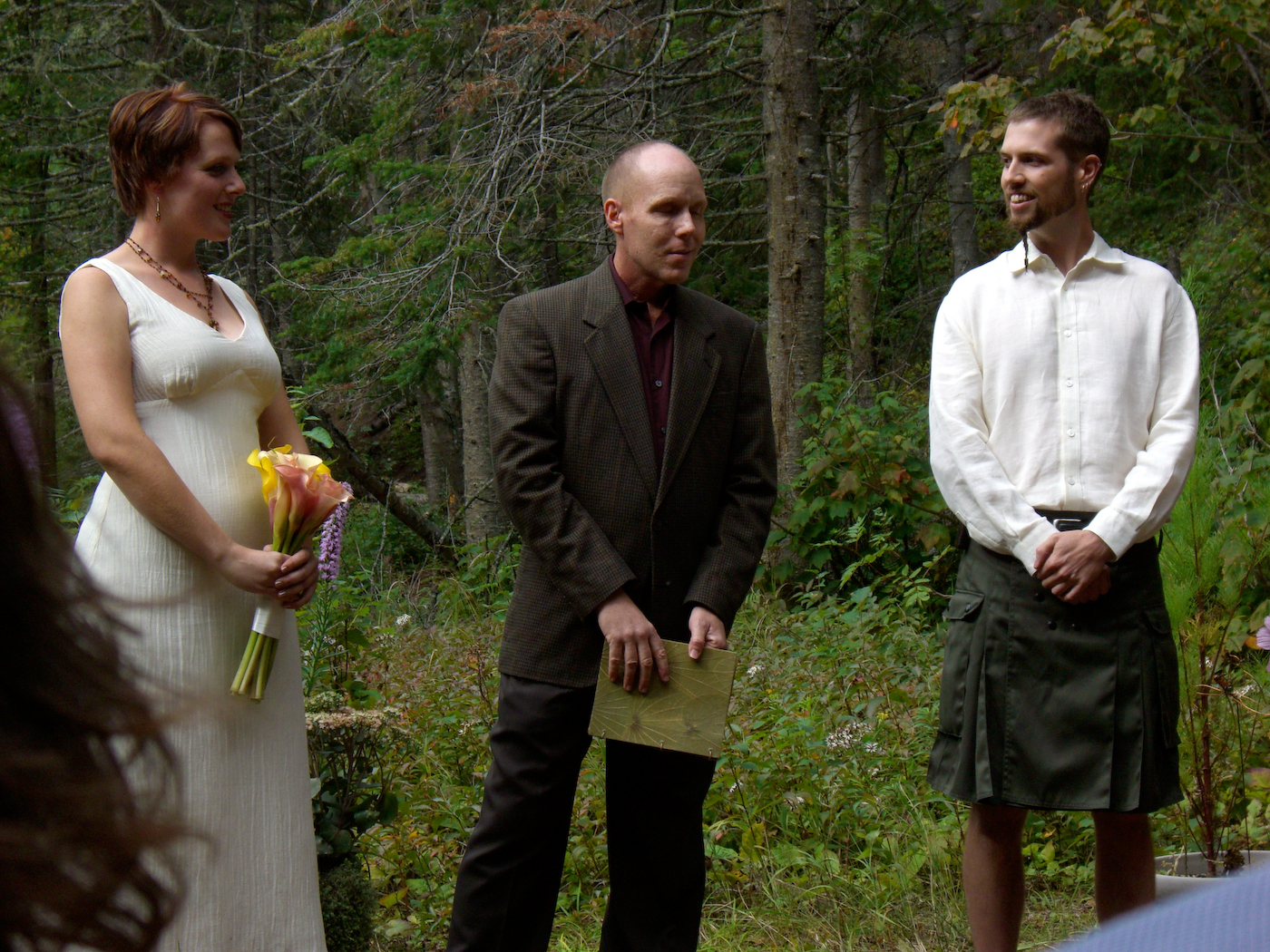 a bride and groom being pographed with other people