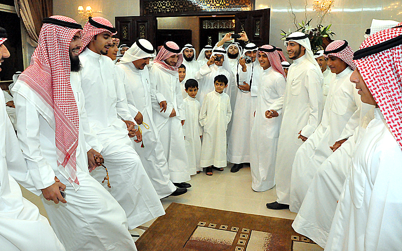 several men in different styles, dressed in white