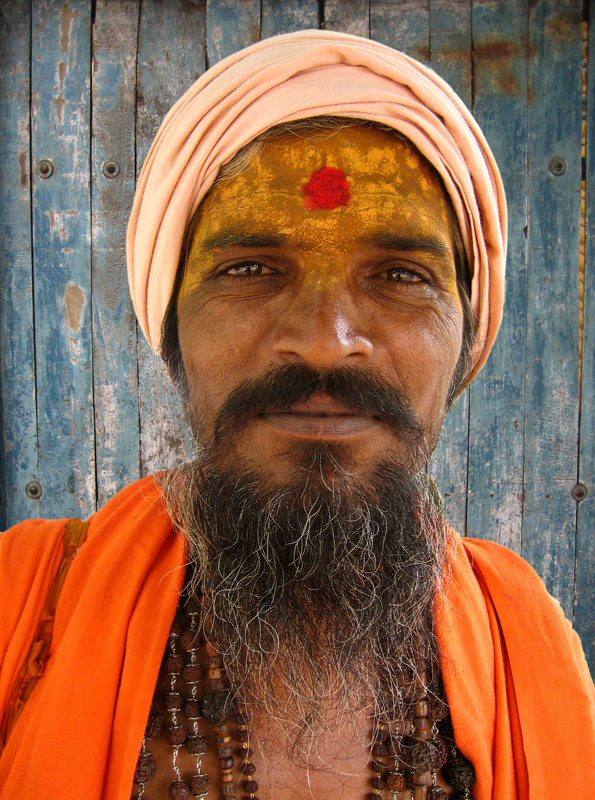 an indian man with a beard and white turban on