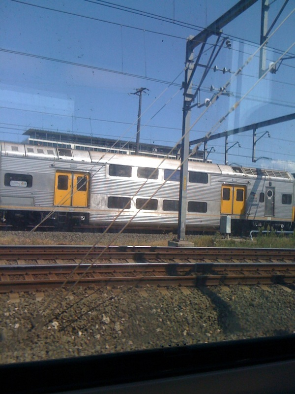 two trains next to each other on the train track