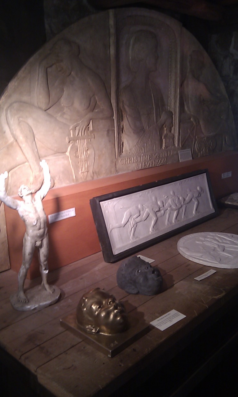 several statues of various types on a table