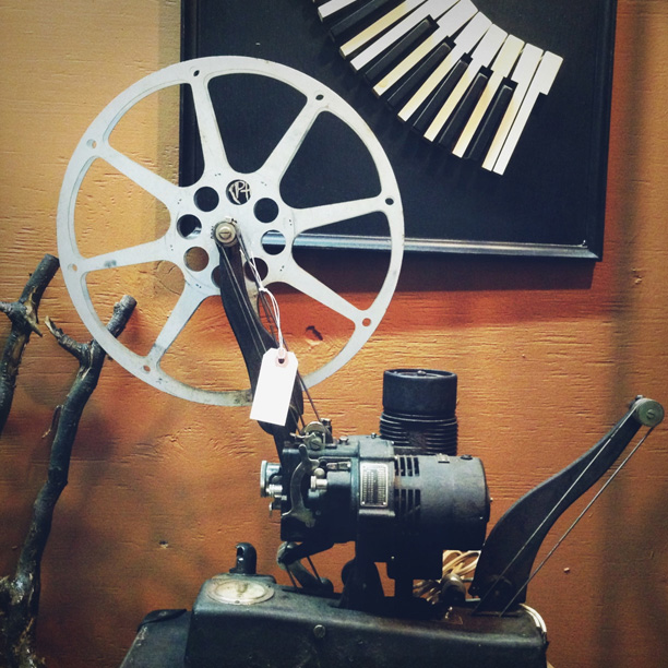 a movie camera sitting on top of a table