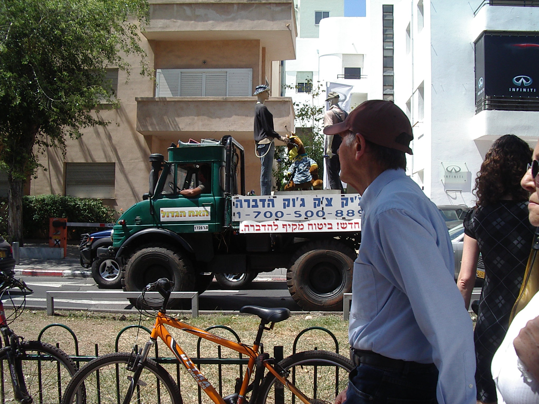 a man standing in front of a truck on the street