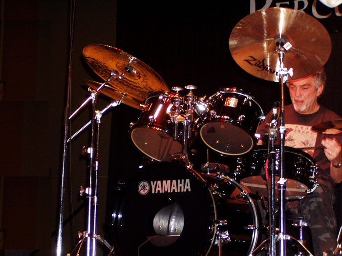 a man with a drummer's set playing drums