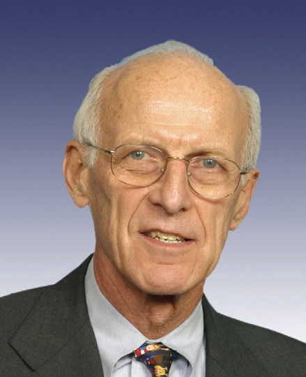 an older gentleman with glasses and a neck tie