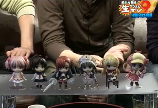 a bunch of small dolls on a table