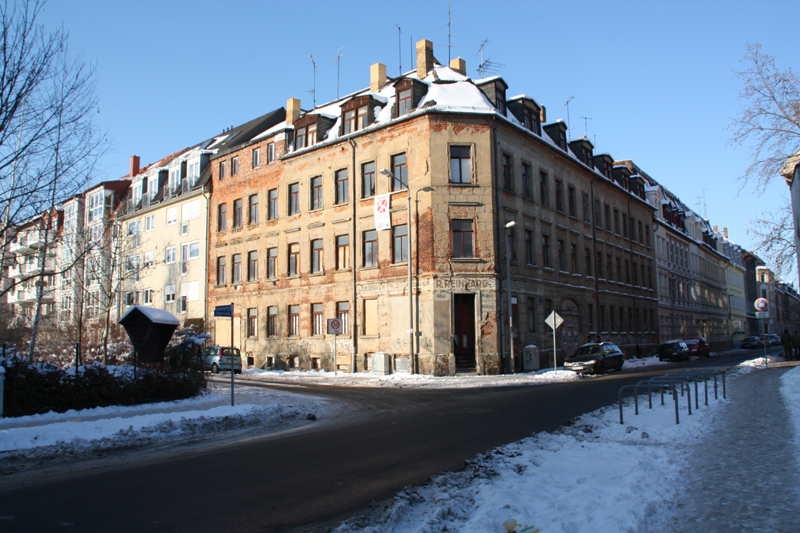 a city street with snow in winter time