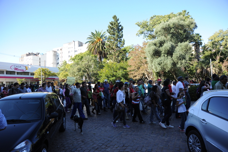 a group of people standing around in a busy area