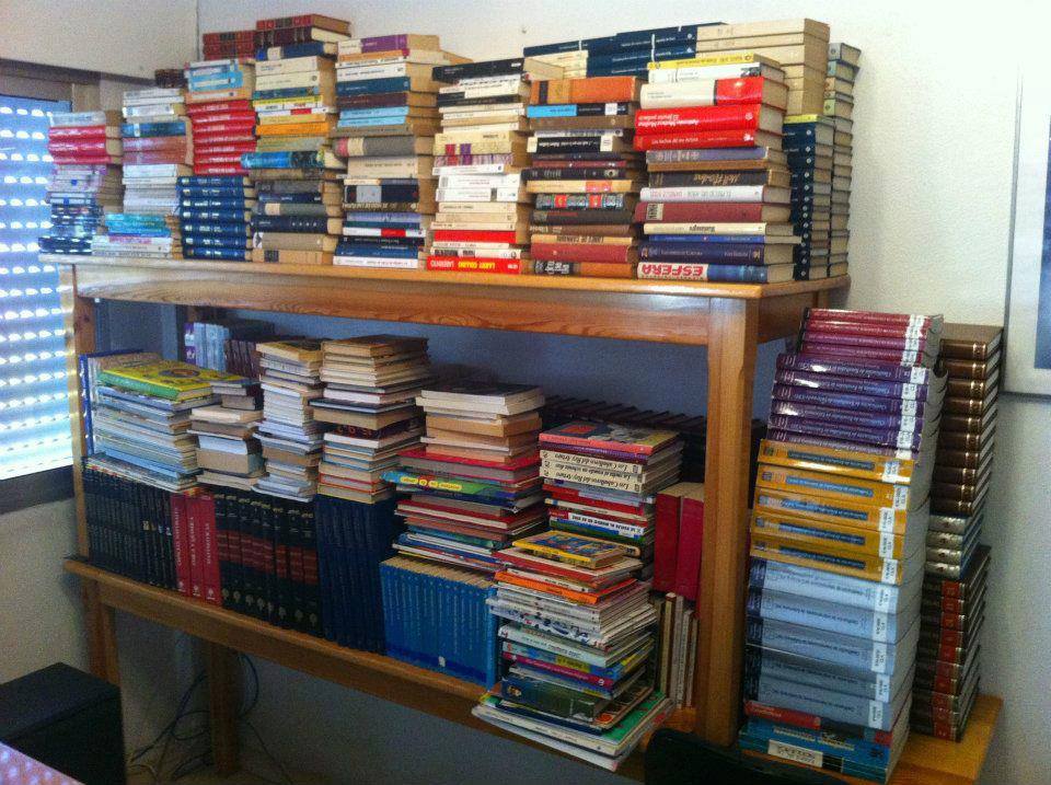 a tall book shelf that is filled with books