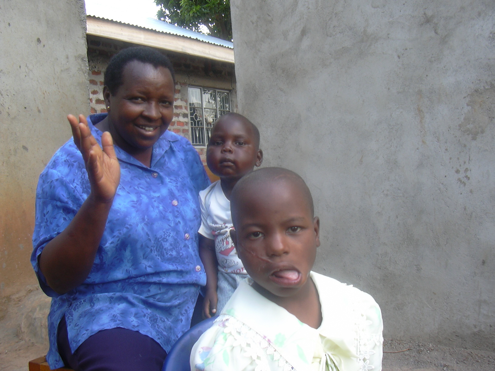 two women and two children sitting on a bench