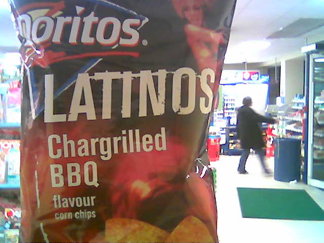a sign advertising potato chips in a convenience store