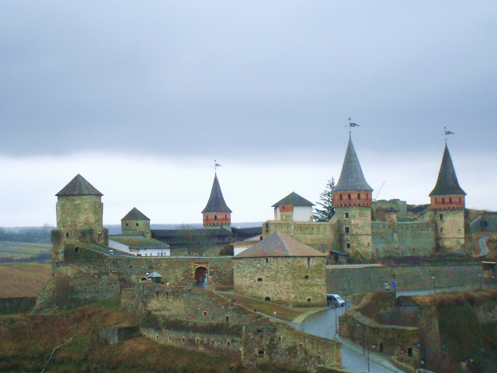 a tall building has many spires on top