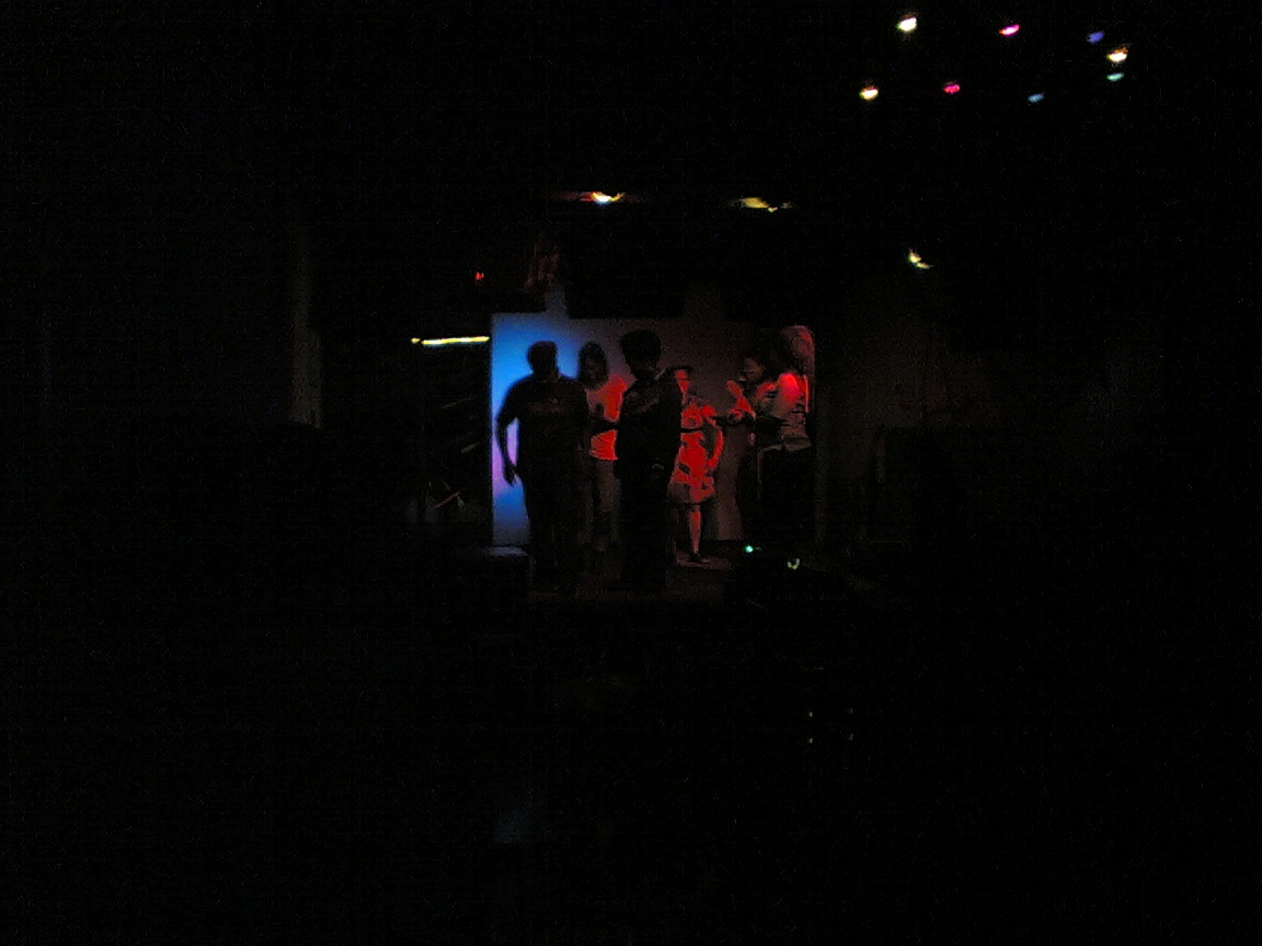 a crowd of people are standing around on stage