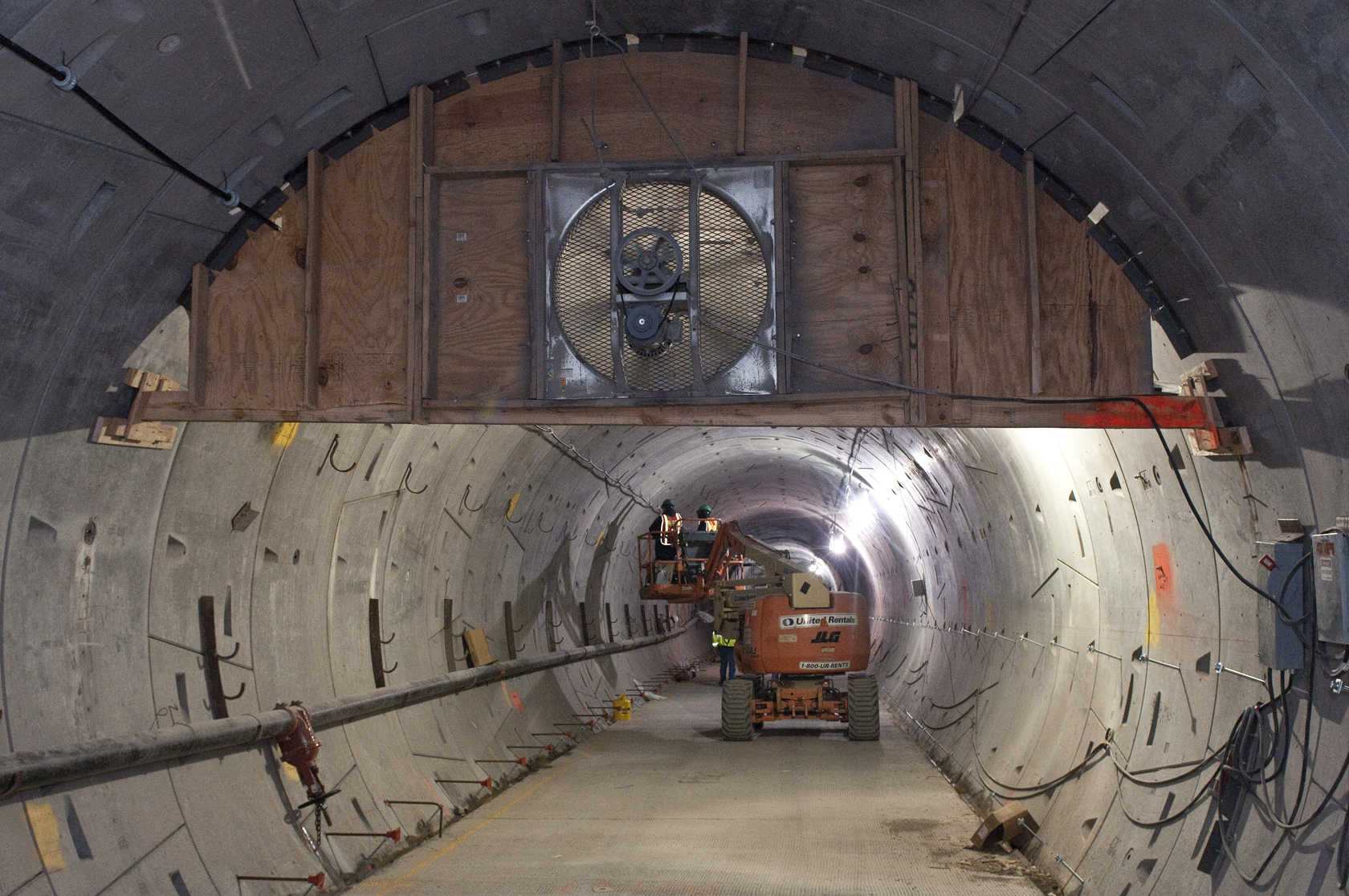 a large tunnel with a bunch of wires running through it