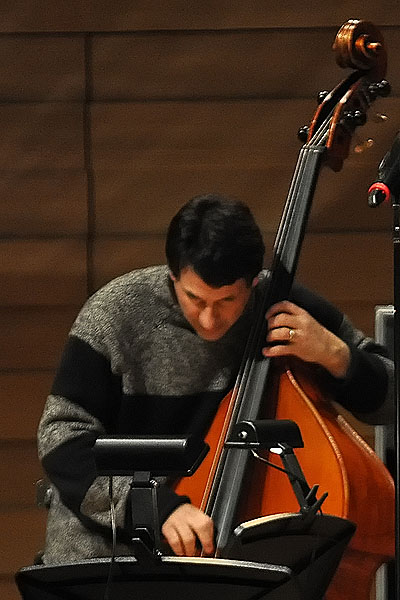 an image of a man that is playing cello