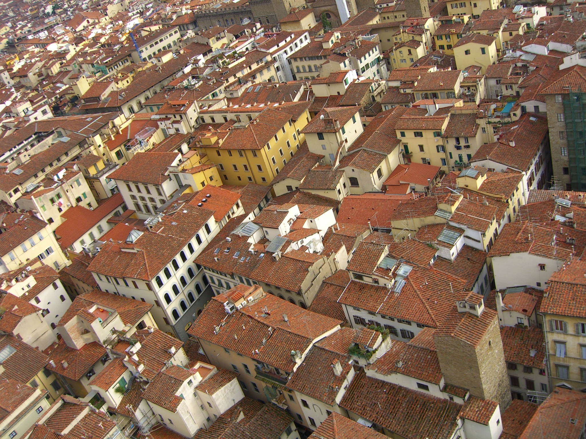 the rooftops of many buildings and roofs are red