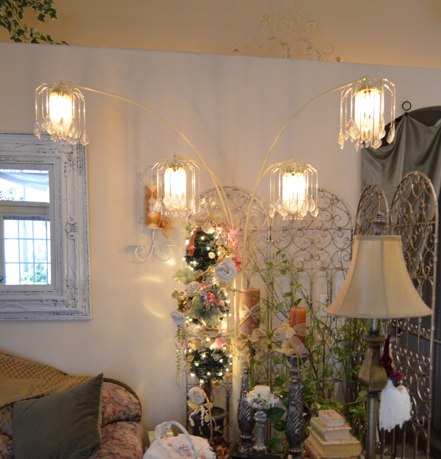 glass jars and mason jar lights hanging from the ceiling