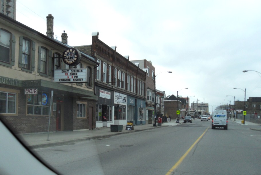 there are cars and trucks traveling on this street