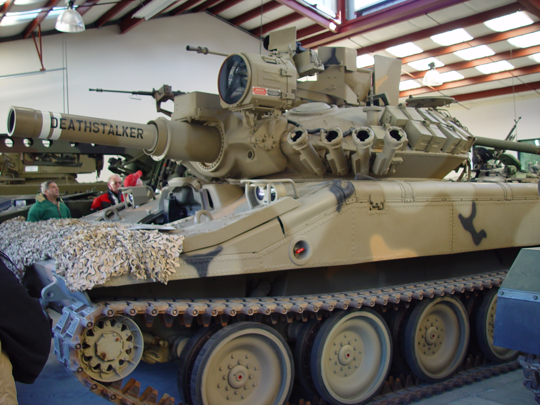 an army tank that is in a large room