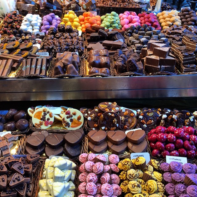 a close up of a display of different types of desserts