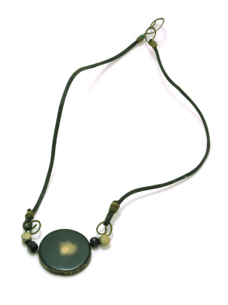 a necklace with a black circle and yellow beads