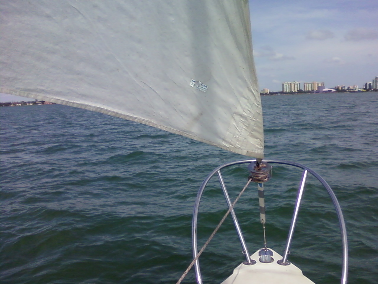 the bow of a sailboat is almost completely visible